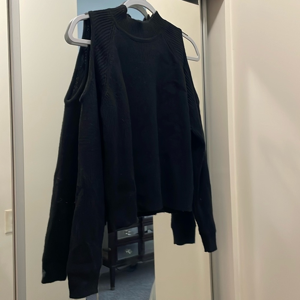 Black cut out shoulder knit long sleeve shirt. Size S.
